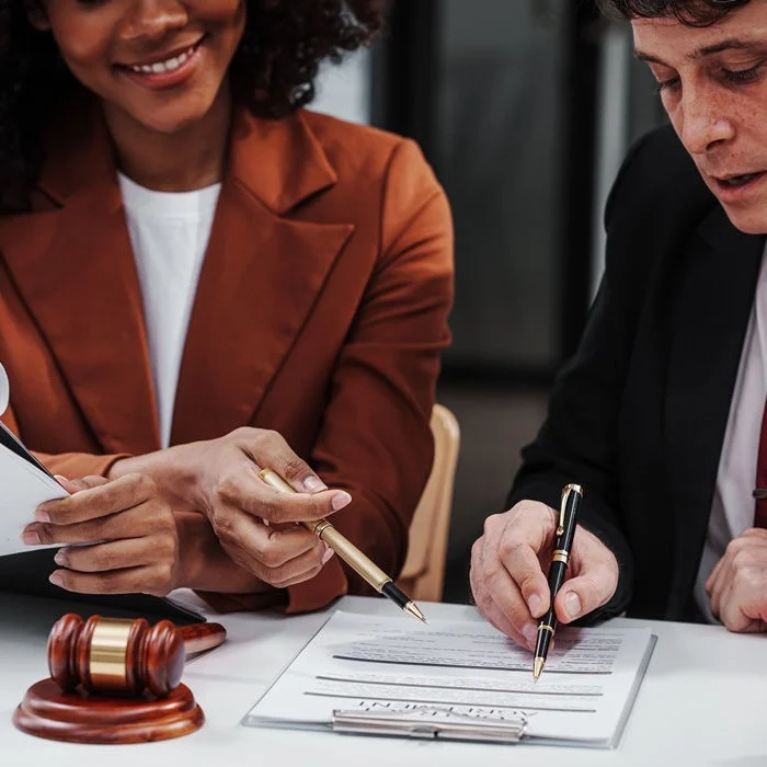 Photo of a lawyer explaining Lemon Law qualifications to a client